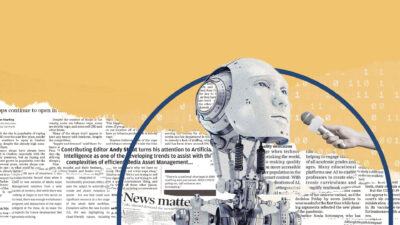 A person interviews a robot. Newspaper pages on artificial intelligence in the background
