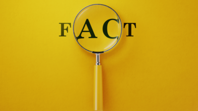 Magnifing glass on a yellow background with a written "Fact" beneath